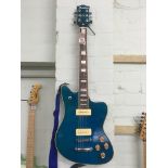 Hutchins six string blue electric guitar in its fitted case