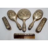 Six piece Edwardian silver Reynolds cherubs decorated dressing table set comprising four brushes,
