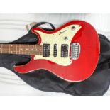 Guvnor six string red and white electric guitar with a five-way selector switch in its black fabric