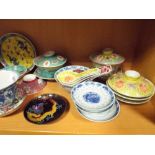 Assorted oriental rice bowls with spoons etc