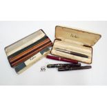 Collection of four fountain pens by Swann & Parker,