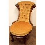 Lady's Victorian walnut framed gold buttoned upholstered occasional chair standing on cabriole legs