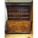 Georgian oak dresser fitted six drawers and cupboards with shelf back