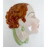 An Art Deco wall plaque of a brunette lady marked on reverse C&C England No 1 18cms tall