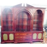 Large and impressive break front open bookcase with three centre drawers,