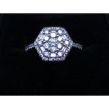 18ct white gold diamond octagonal panel cluster ring, set with brilliant and baguette cut diamonds,