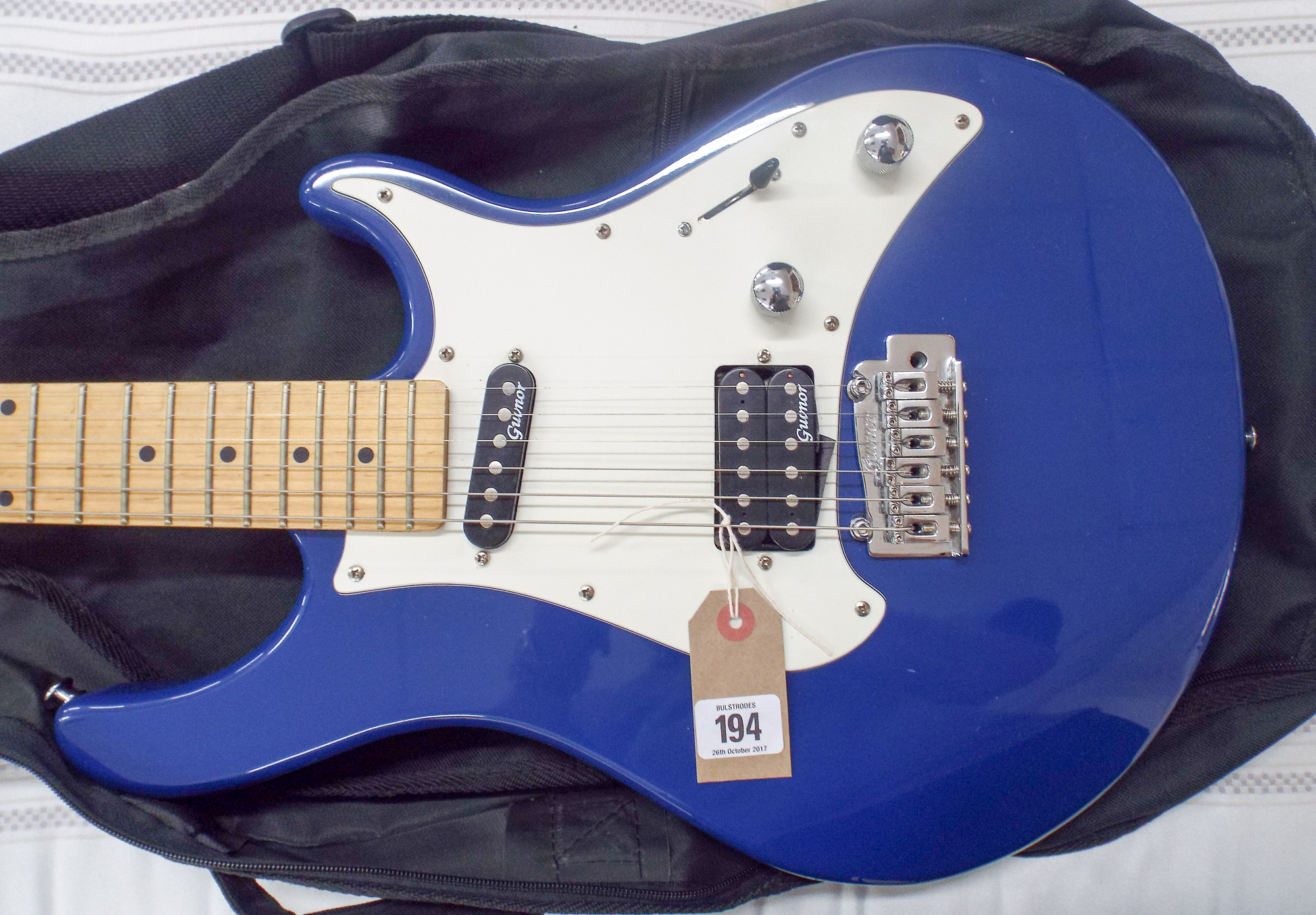 Guvnor blue and white electric guitar with a five-way selector switch in its black fabric fitted