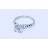 Modern solitaire diamond engagement ring set with a circular brilliant cut diamond of approx 1 ct