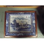 A pair of framed blue and white Delft wall plaques (1 cracked)