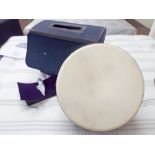 Black effect hand drum with its stand and its carrying case. 16.