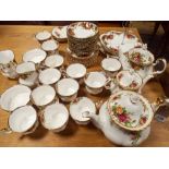 Royal Albert Old Country Roses tea service comprising three teapots of various sizes, cake stands,