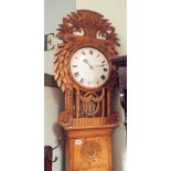 French grandfather clock in decorative carved pine case