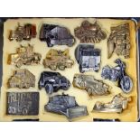 Case of 14 assorted brass and other belt buckles to include trucks, bulldozer, cars,