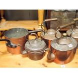 Nine various Victorian copper kettles and a heavy copper saucepan