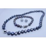 Row of grey freshwater pearls with 18ct white gold bead fastening,