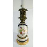 An early 20th century porcelain lamp base with later conversion to electricity signed L Hadret to