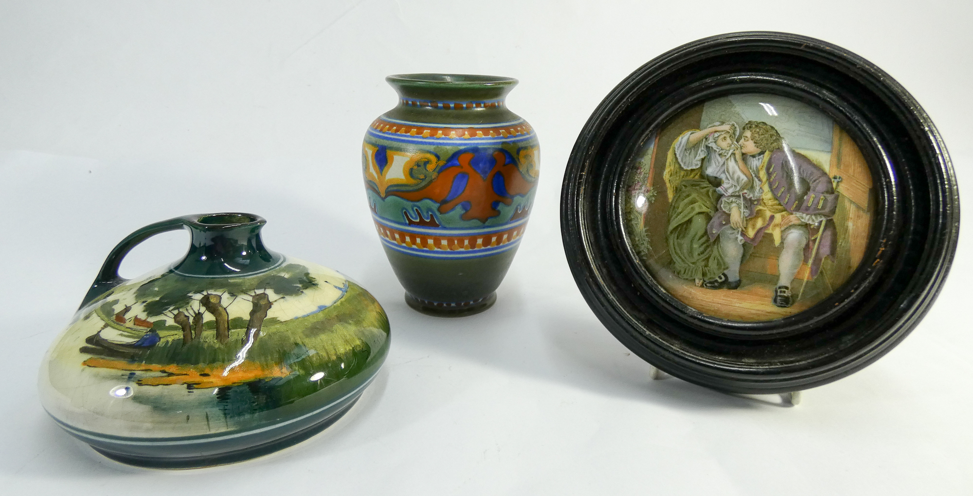 Two pieces of Gouda pottery and a pot lid in frame