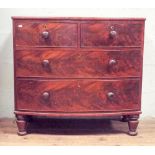 Early Victorian mahogany bow front chest of two long and two short drawers with bun handles,