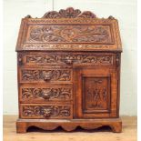 Victorian carved pussycat oak bureau with four drawers and cupboard under standing approx 3' wide