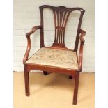 A Chippendale style mahogany elbow chair with tapestry upholstered seat