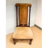 A late Victorian mahogany framed prie dieu chair upholstered cord material