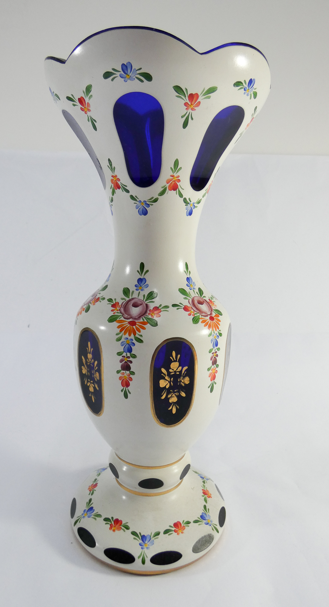 Bohemian overlaid blue glass vase decorated with flowers, height 31cm.