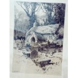 An oak framed black and white print of a church scene