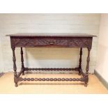 Victorian dark oak hall table fitted one drawer with pie crust edge standing on bobbin turned legs,