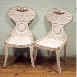 Pair of regency style white painted hall chairs with shell backs