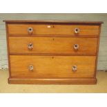 A late Victorian mahogany chest of 3 long drawers with glass knob handles 3'8 wide