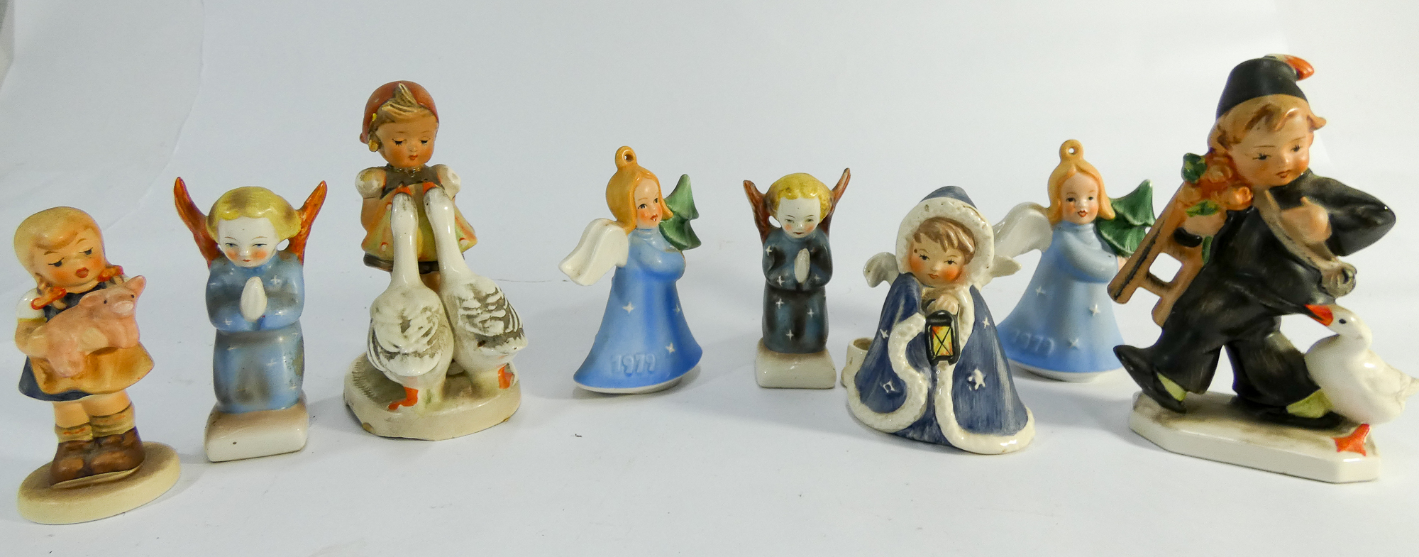 Collection of eight Hummel figurines to include 1979 Christmas angels