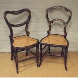 Two Victorian black lacquered gilt and mother of pearl decorated bedroom chairs with cane seats