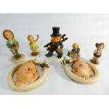 Collection of seven Hummel figurines of children and wall plaques of babes with bees.