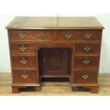Good quality Georgian style mahogany desk fitted eight drawers with centre kneehole cupboard,