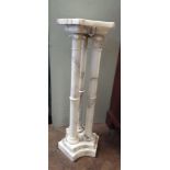 A white grained marble triple column bust or plant stand