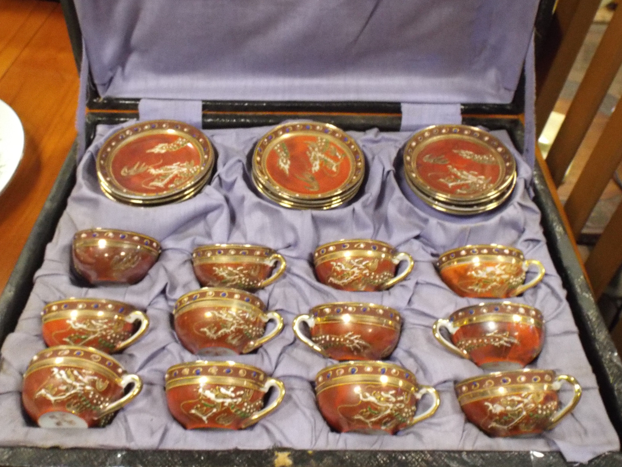 A Japanese Satsuma coffee set of 12 cups and 12 saucers in case