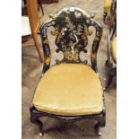 A Victorian black lacquered gilt and mother of pearl decorated occasional chair with cane panelled