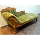 A late Victorian inlaid walnut framed Chaise Longue upholstered in buttoned green material