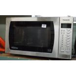 A Panasonic inverter microwave oven in silver case