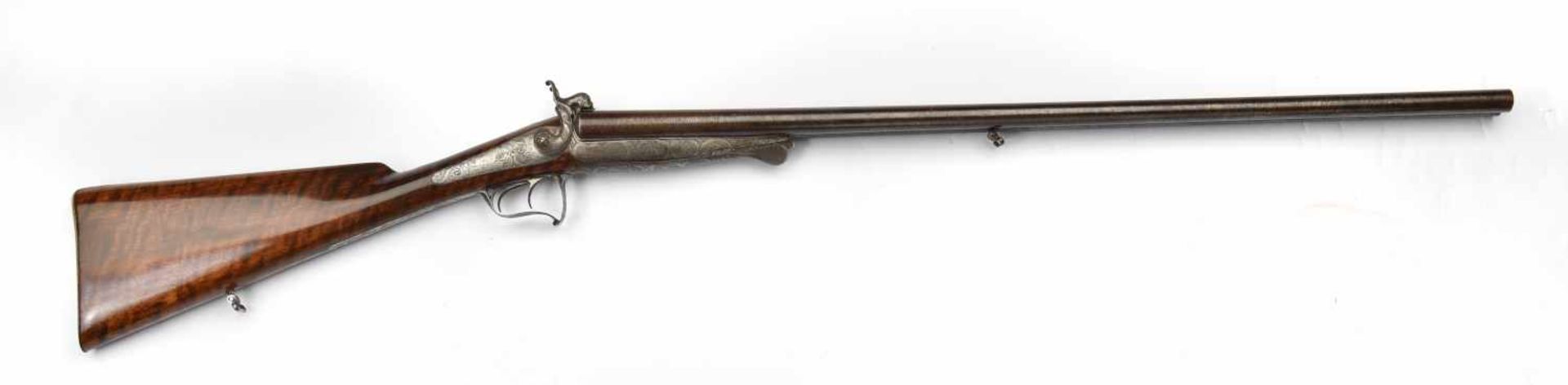 Fusil de chasse à broche signé par Dubout . A deux canons juxtaposés, calibre 16, canons damas,