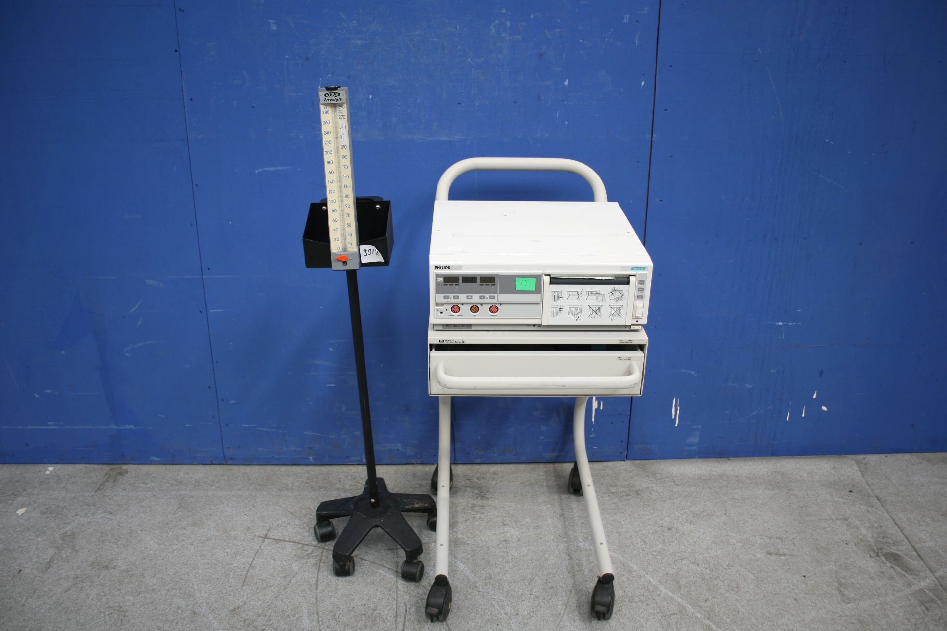 Philips Series 50 XM Fetal Monitor On Trolley And Accoson Freestyle Blood Pressure Monitor