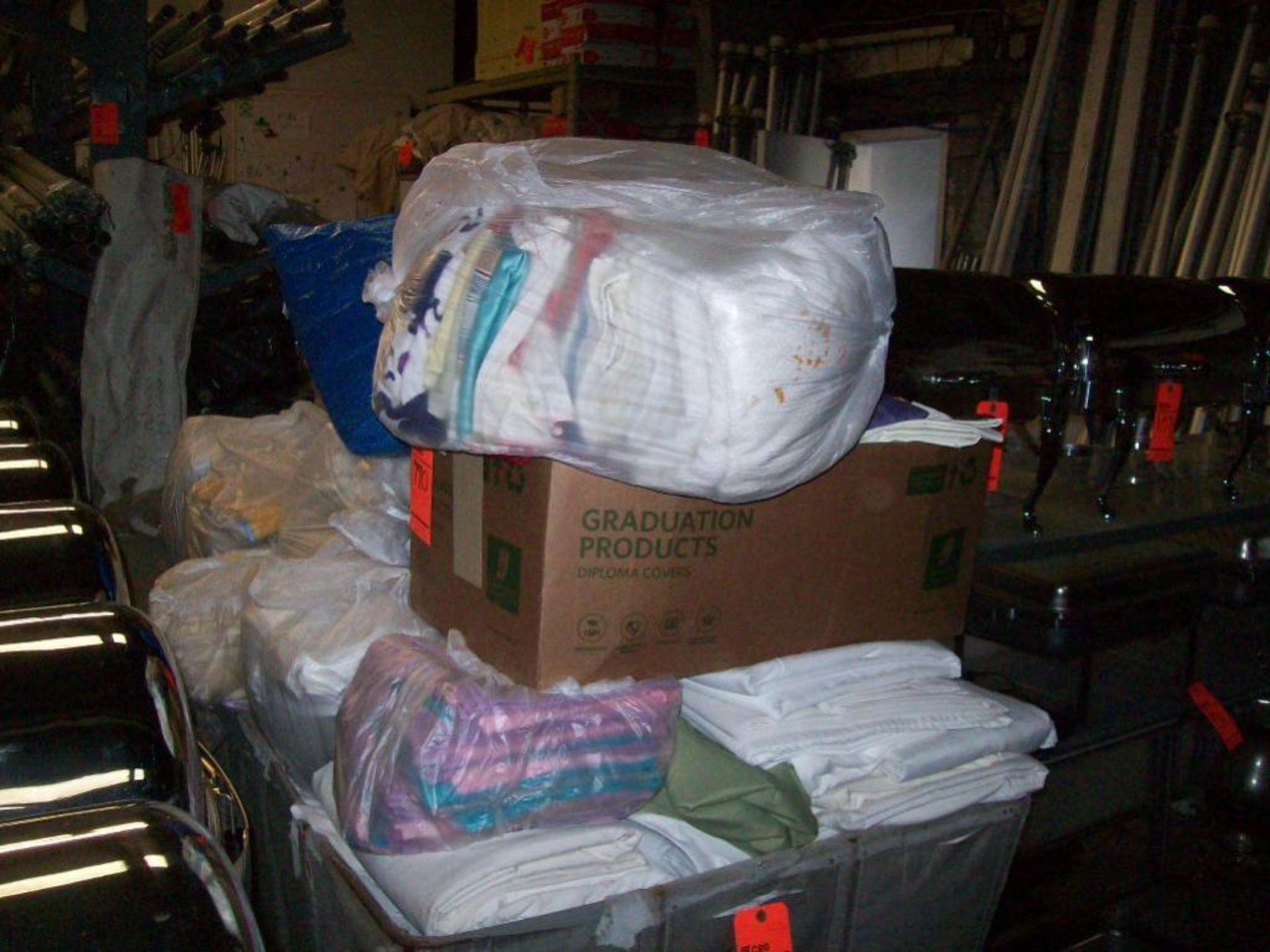 Lot of assorted linens with cart