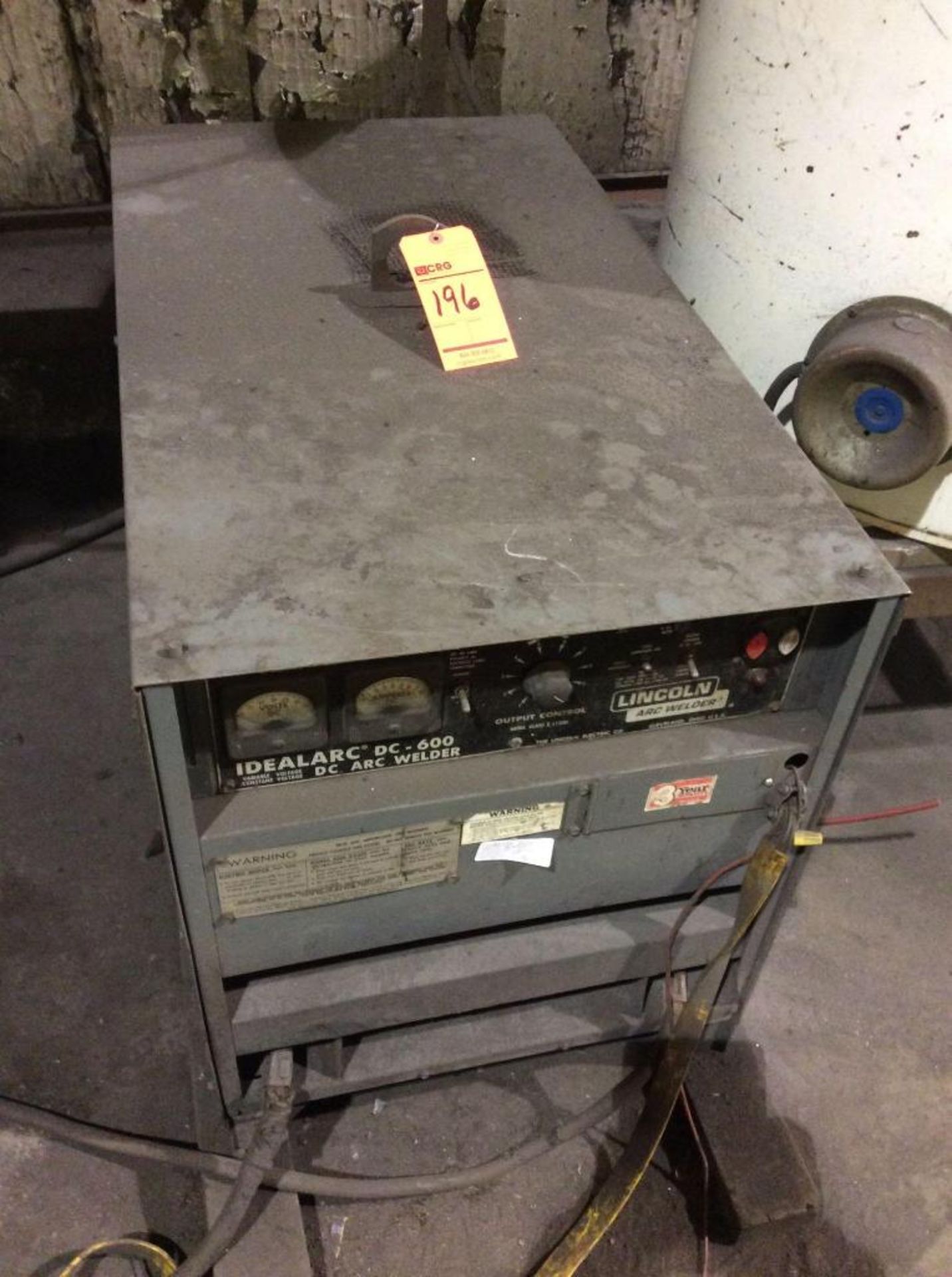 Lincoln Idealarc dc arc welder, m/n DC-600 on floor next to head plate welder also Lincoln