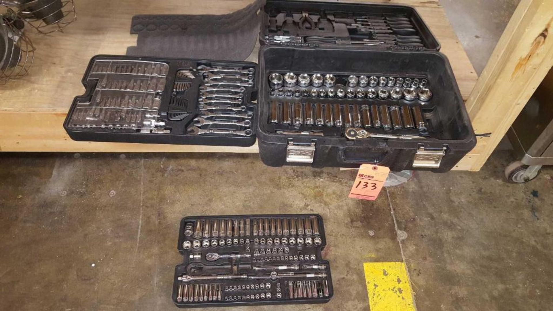 Tool box with assorted ratchet wrenches, box wrenches, screw drivers, etc.