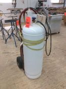 Tank of contact adhesive (wilsonart 731) with spray gun and handtruck