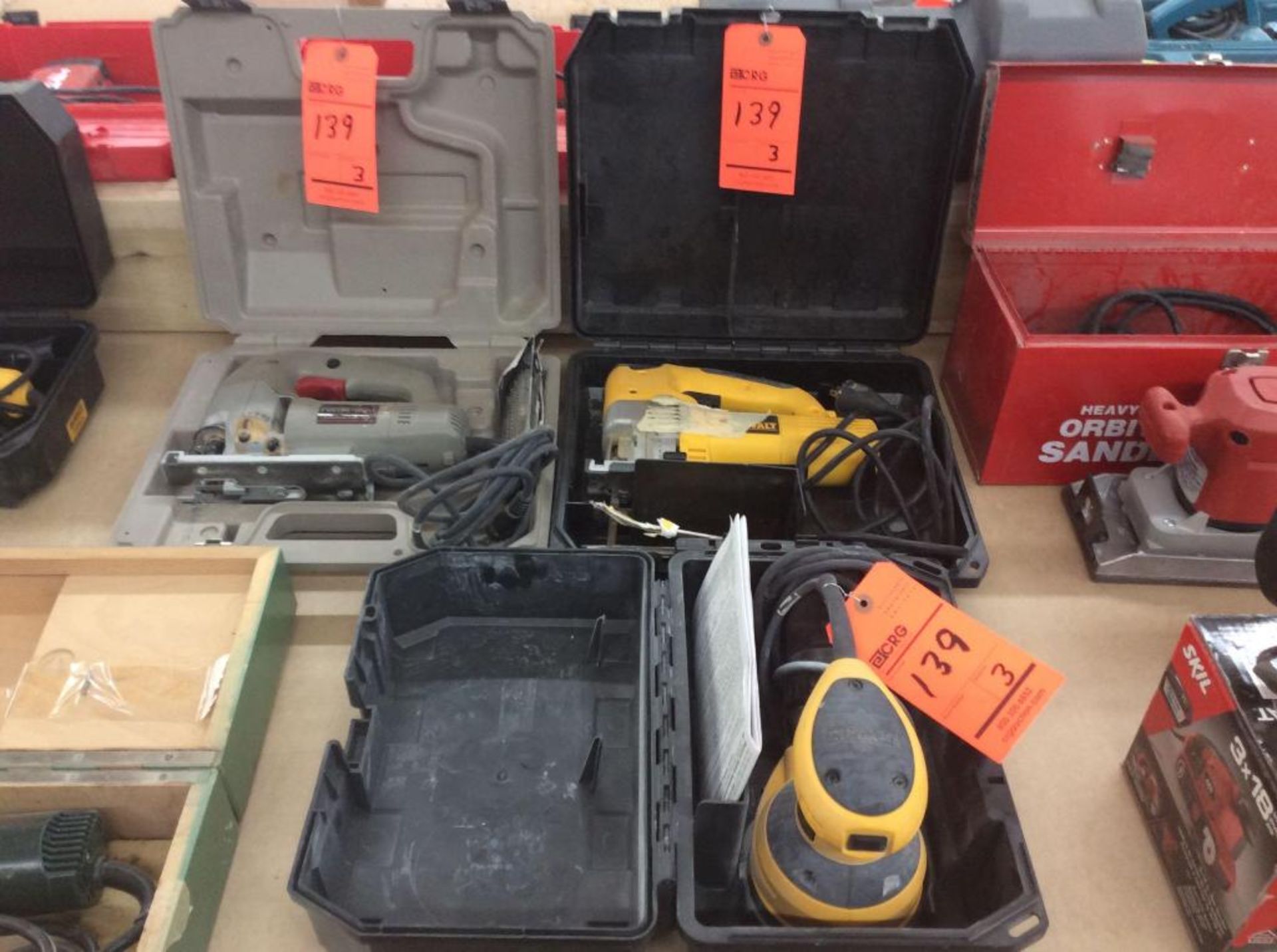 Lot of (3) asst hand tools including (1) Dewalt orbiting palm sander mn D26451 (1) Dewalt jigsaw mn