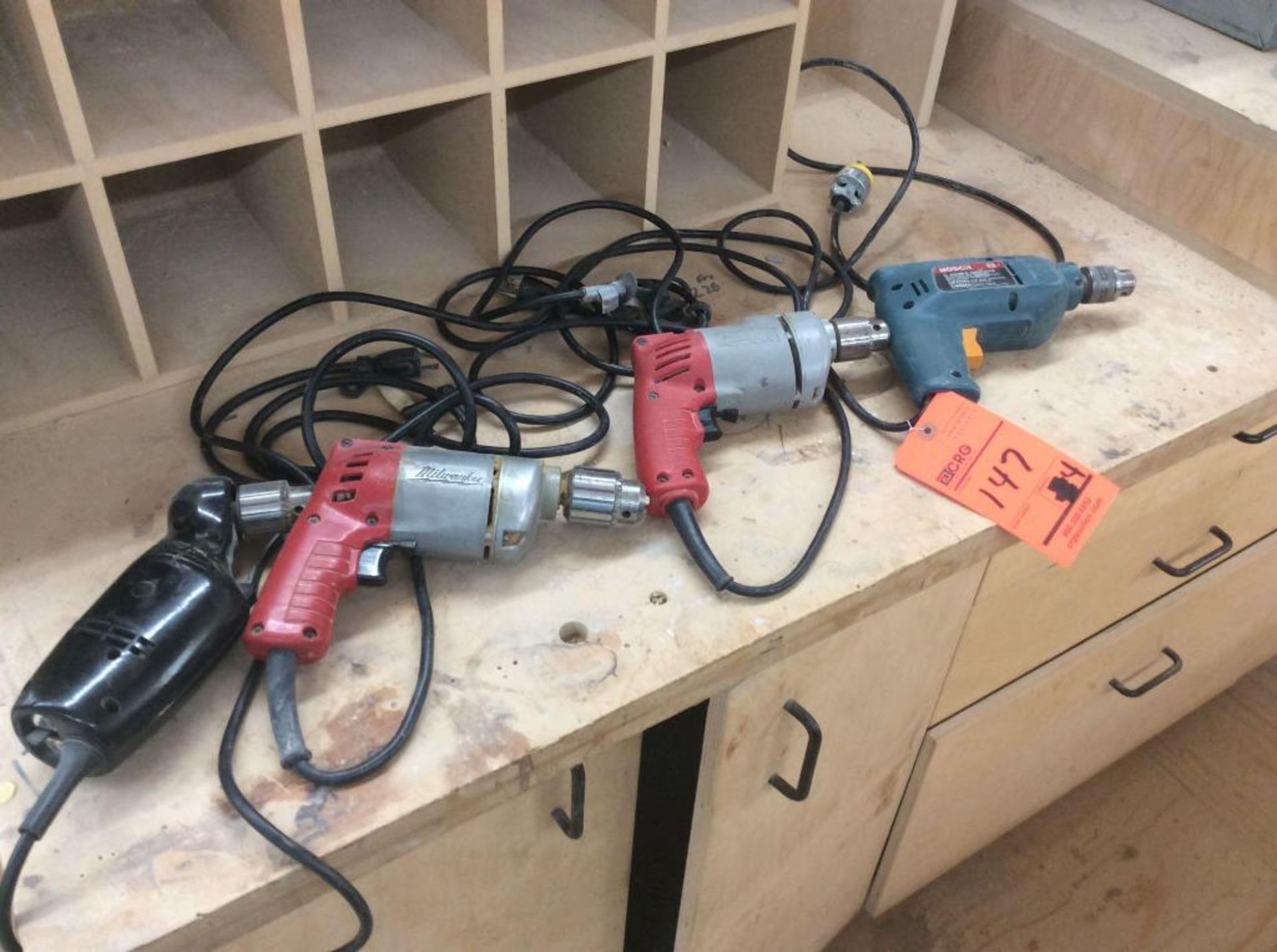 Lot of (4) asst electric drills including (2) Milwaukee 3/8" (1) Bosch double insulated mn 1158VSR 3