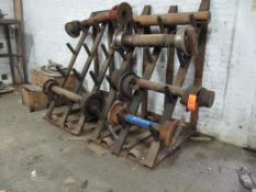 Lot of assorted shafts and axles includes: (3) sections of put together pallet racking