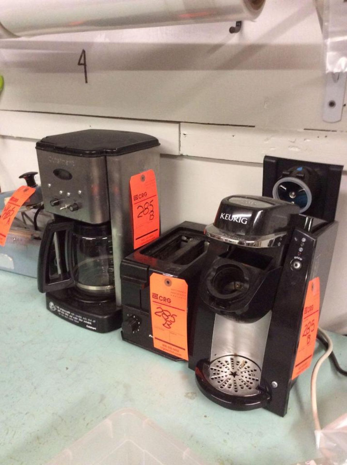 Lot of asst kitchen appliances (coffee makers, microwave, etc), asst dishware, and cleaners