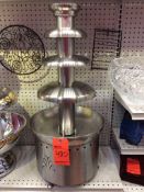 Stainless steel chocolate fountain comes with 30 pounds of chocolate, needs 15 pounds to operate